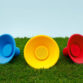 icon-speakers-blue-yellow-red-on-grass