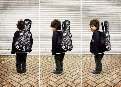 kid-wearing-guitar-back-pack-to-school